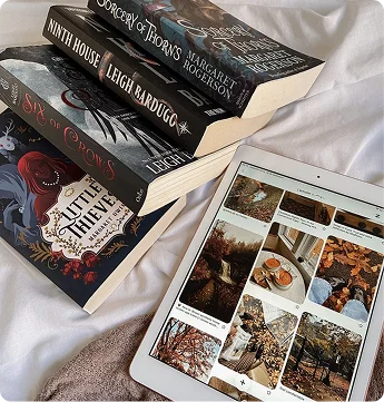 Fantasy books next to a tablet